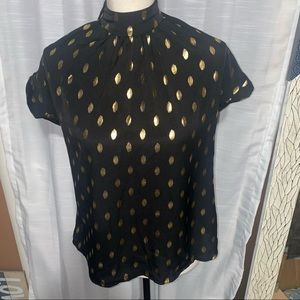 Black elegant blouse for special occasion. All around gold print